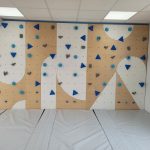 Indoor playroom climbing zone with soft mat